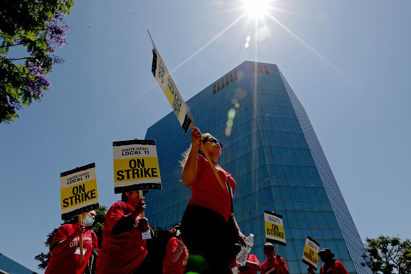 Los Angeles, CA - Members of the Unite Here! Local 11 hotel workers union picket the LAX Sheraton after walking off the job on Monday, July 10, 2023. July 10: in Los Angeles on Monday, July 10, 2023 in Los Angeles, CA. (Luis Sinco / Los Angeles Times)