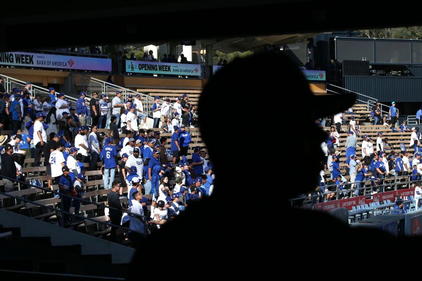 LOS ANGELES, CA - APRIL 14: Dodger fans start to fill the left field pavilion during opening day.