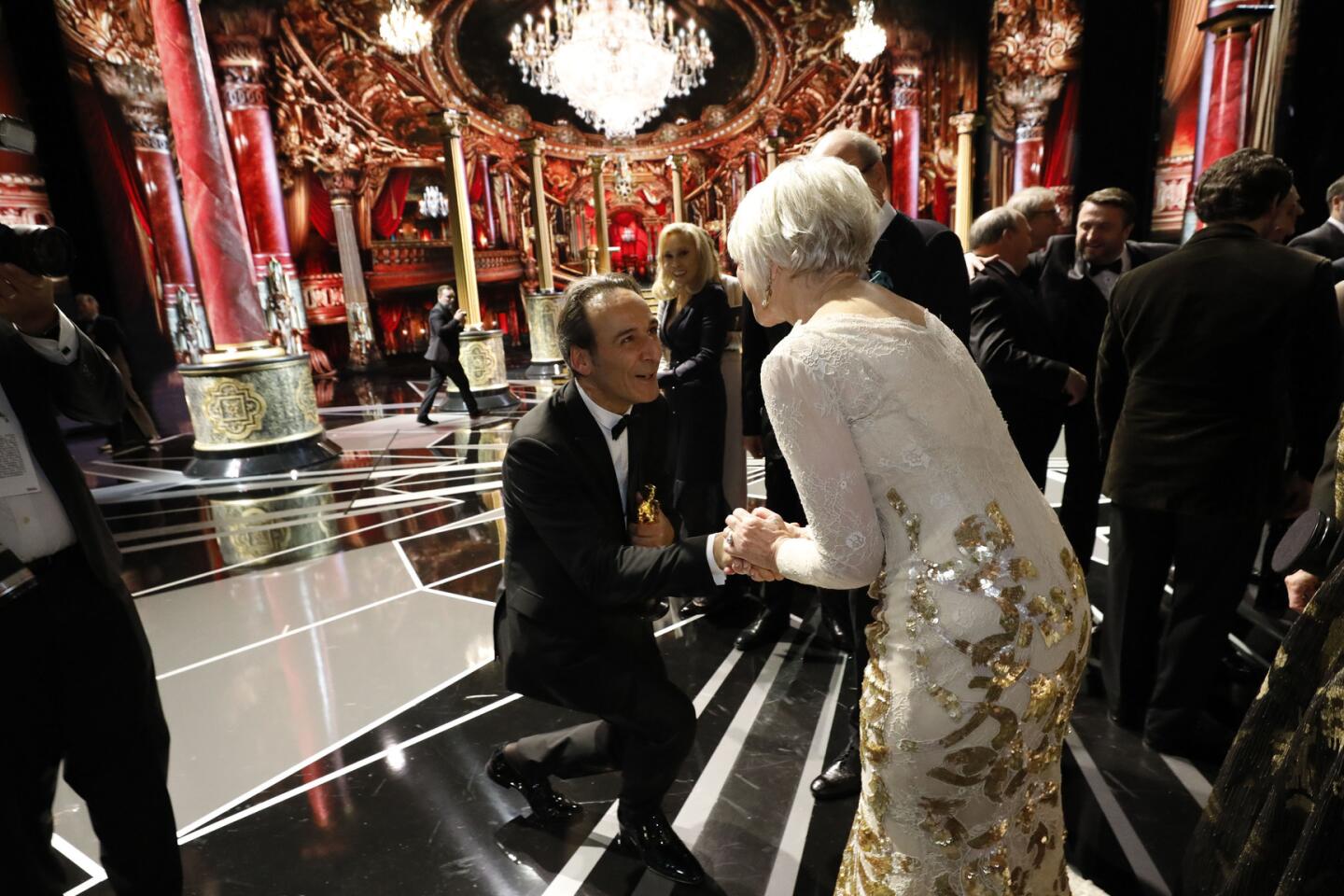 Oscar winners Helen Mirren and Alexandre Desplat backstage at the 90th Academy Awards.