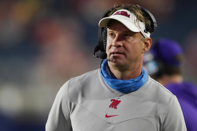 Mississippi head coach Lane Kiffin watches a replay during the second half of the team's NCAA college football game against Tulane on Saturday, Sept. 18, 2021, in Oxford, Miss. Mississippi won 61-21. (AP Photo/Rogelio V. Solis)