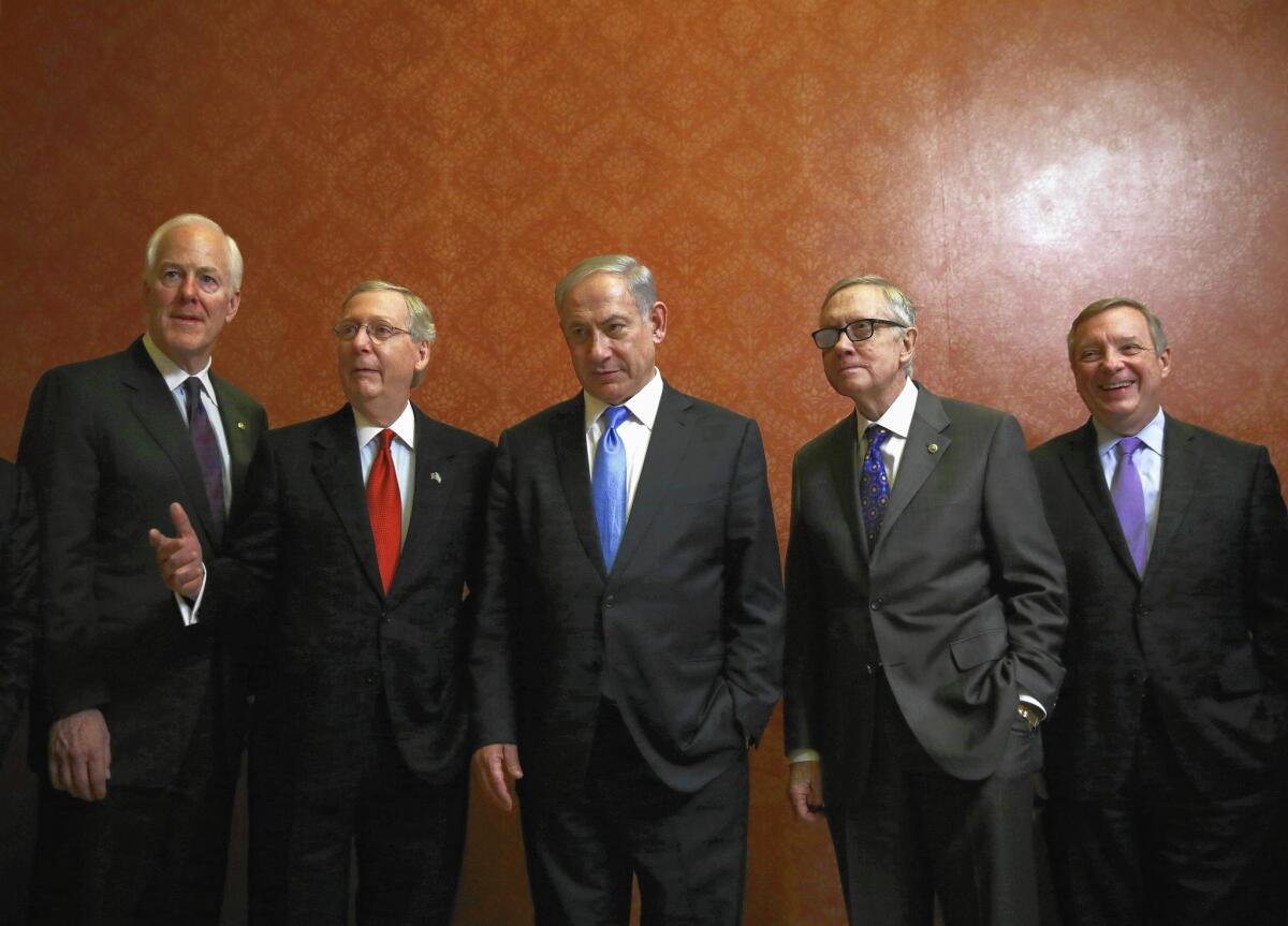 Israeli Prime Minister Benjamin Netanyahu is flanked by, from left, Senate Majority Whip John Cornyn (R-Texas), Majority Leader Mitch McConnell (R-Ky.), Minority Leader Harry Reid (D-Nev.) and Minority Whip Richard J. Durbin (D-Ill.) at the Capitol.