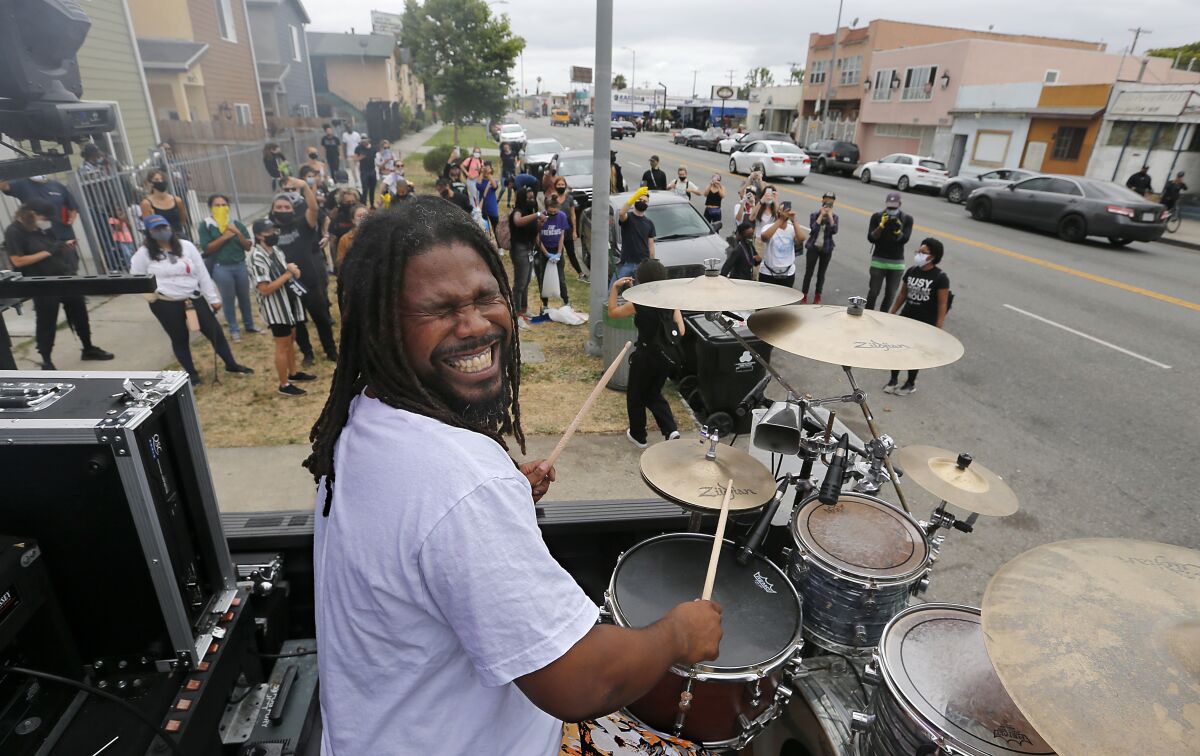 Drummer Sheriff Drumman performs for volunteers at the cleanup.