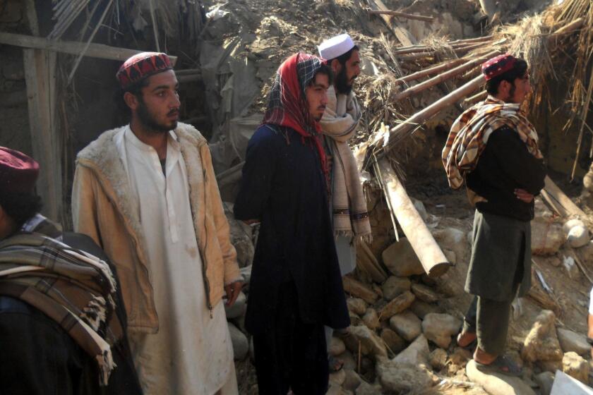 Pakistani Islamic students gather at the destroyed religious seminary belonging to the Haqqani network after a US drone strike in the Hangu district of Khyber Pakhtunkhwa province on November 21, 2013. A US drone killed six people in northwest Pakistan in only the second such strike outside the country's lawless tribal districts, threatening to inflame tensions between Washington and Islamabad. AFP PHOTO/SB SHAHSB SHAH/AFP/Getty Images ORG XMIT: ** OUTS - ELSENT, FPG, TCN - OUTS * NM, PH, VA if sourced by CT, LA or MoD ** ORG XMIT: CHI1311210825507579