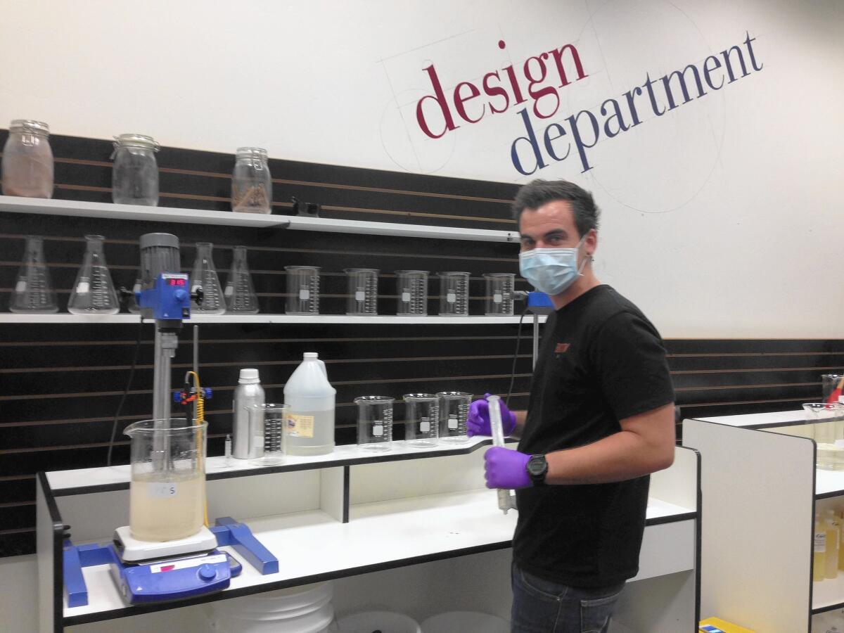 California Vaping Co. founder Dakoda Collins, in his San Diego laboratory, prepares to add liquid nicotine to a batch of e-liquid.
