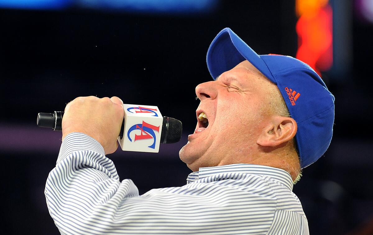 New Clippers owner Steve Ballmer greets the fans during a rally at the Staples Center in August of 2014.
