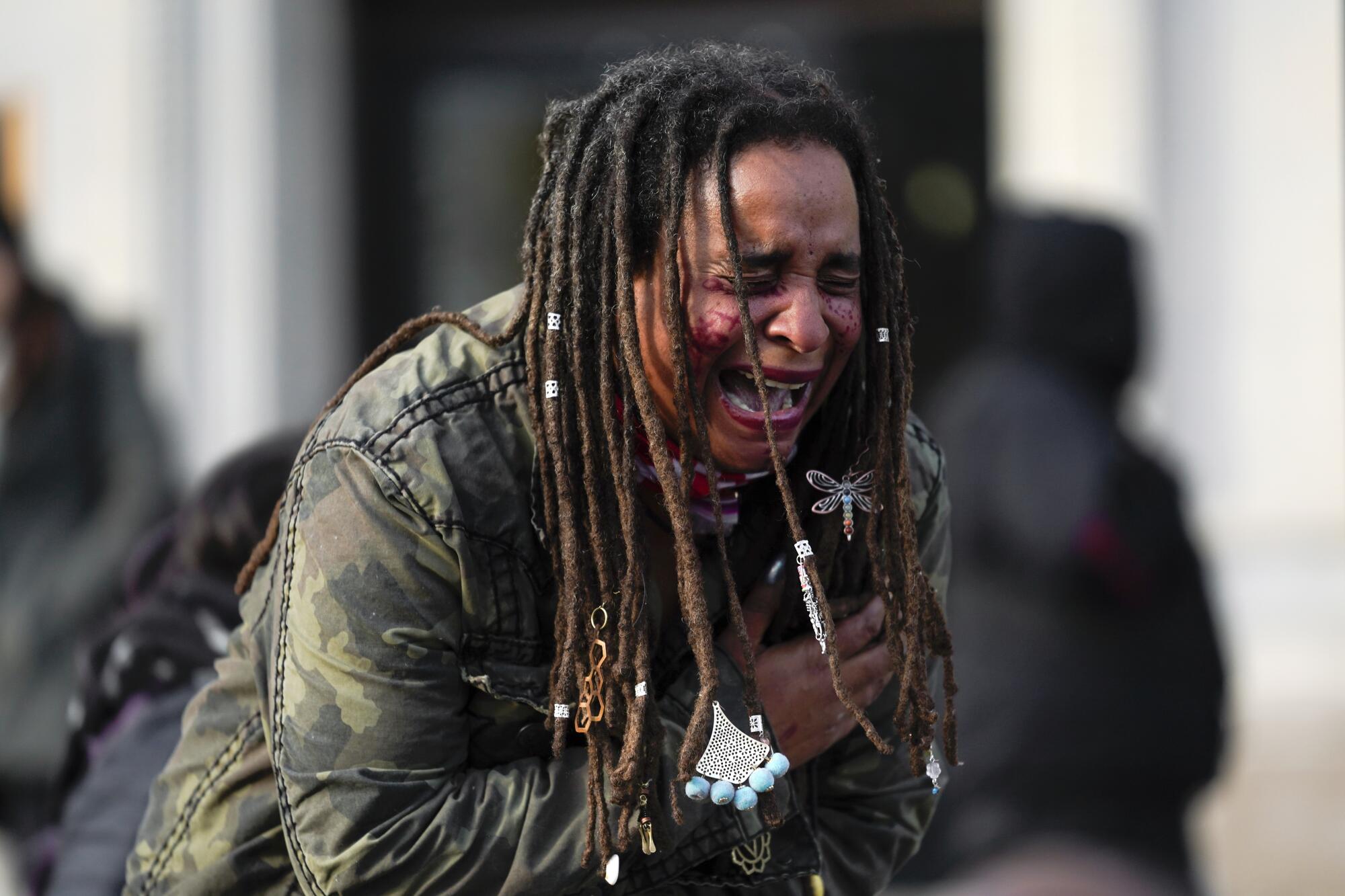 A woman recites poetry outside the Kenosha County Courthouse on Friday.