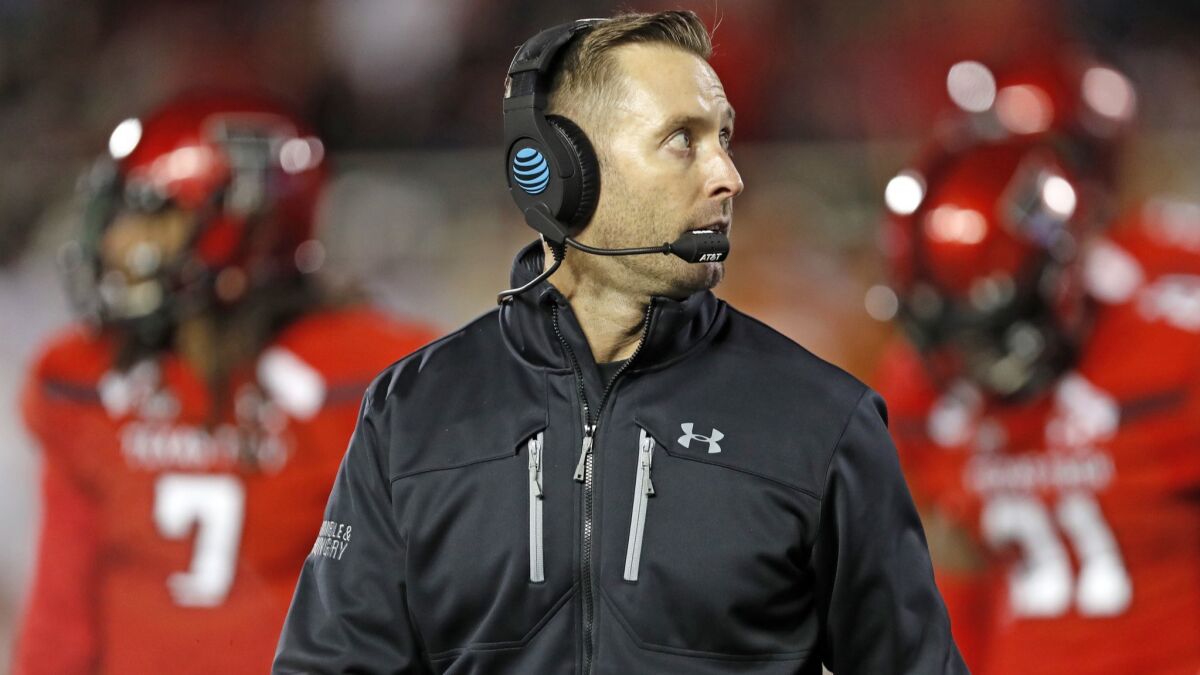 Kliff Kingsbury walks off the field during the first half of a game between Texas Tech and Texas on Nov. 10.