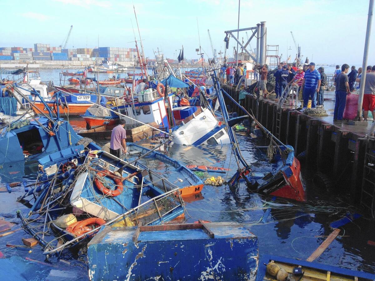 Sinking fishing boats in a cove at Iquique, northern Chile, after the magnitude 8.2 earthquake.