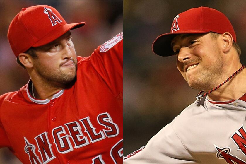 Angels pitchers Huston Street, left, and Joe Smith have played vital roles in helping the team stay in the hunt for first place in the AL West division.