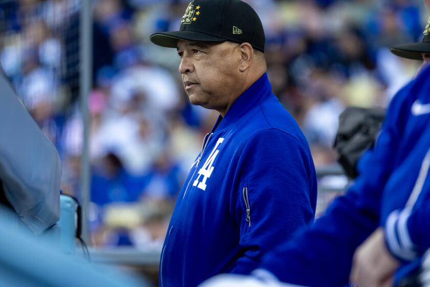 LOS ANGELES, CA - MAY18, 2024: Los Angeles Dodgers manager Dave Roberts in the dugout during the game against the Cincinnati Reds at Dodger Stadium on May 18, 2024 in Los Angeles, California.(Gina Ferazzi / Los Angeles Times)