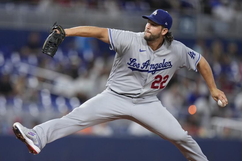 Los Angeles Dodgers' Clayton Kershaw delivers a pitch during the first inning.