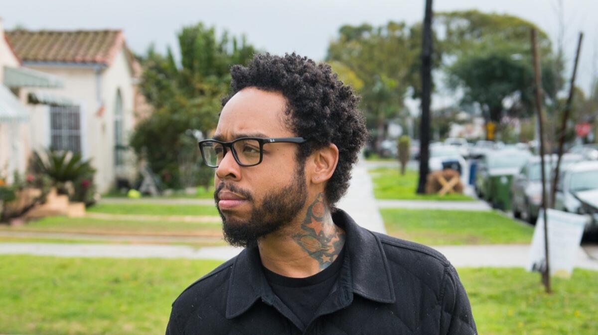Producer and musician Terrace Martin walks through the Crenshaw neighborhood. He just released a new collaboration with Salaam Remi.