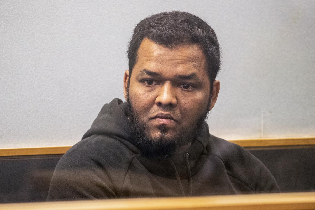 Ahamed Aathil Samsudeen appears in the High Court in Auckland, New Zealand, on Aug. 7, 2018, after he was found possessing a series of images which depict extreme violence, cruelty, death and graphic war scenes. Samsudeen grabbed a kitchen knife from a store shelf and begins stabbing shoppers while chanting “Allahu akbar” — meaning “God is great” at a Countdown supermarket on Sept. 3, 2021 New Zealand feared the extremist but found no way to stop him. (Greg Bowker/New Zealand Herald via AP)