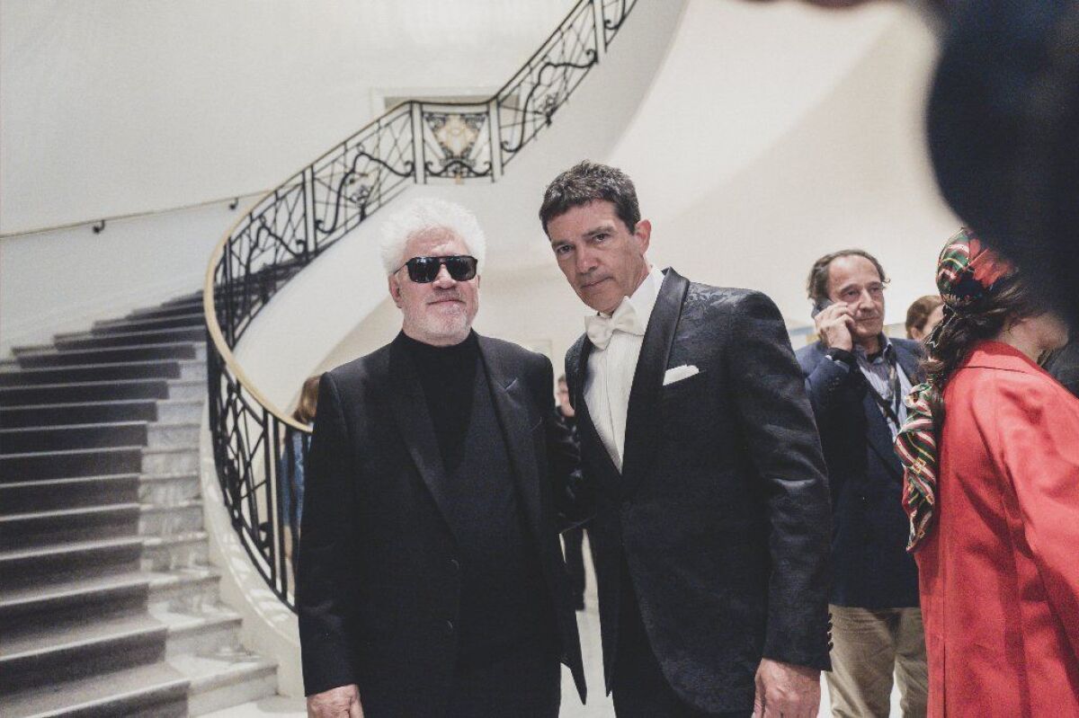 Pedro Almodóvar, left, and Antonio Banderas leave the Martinez Hotel during the 72nd annual Cannes Film Festival.