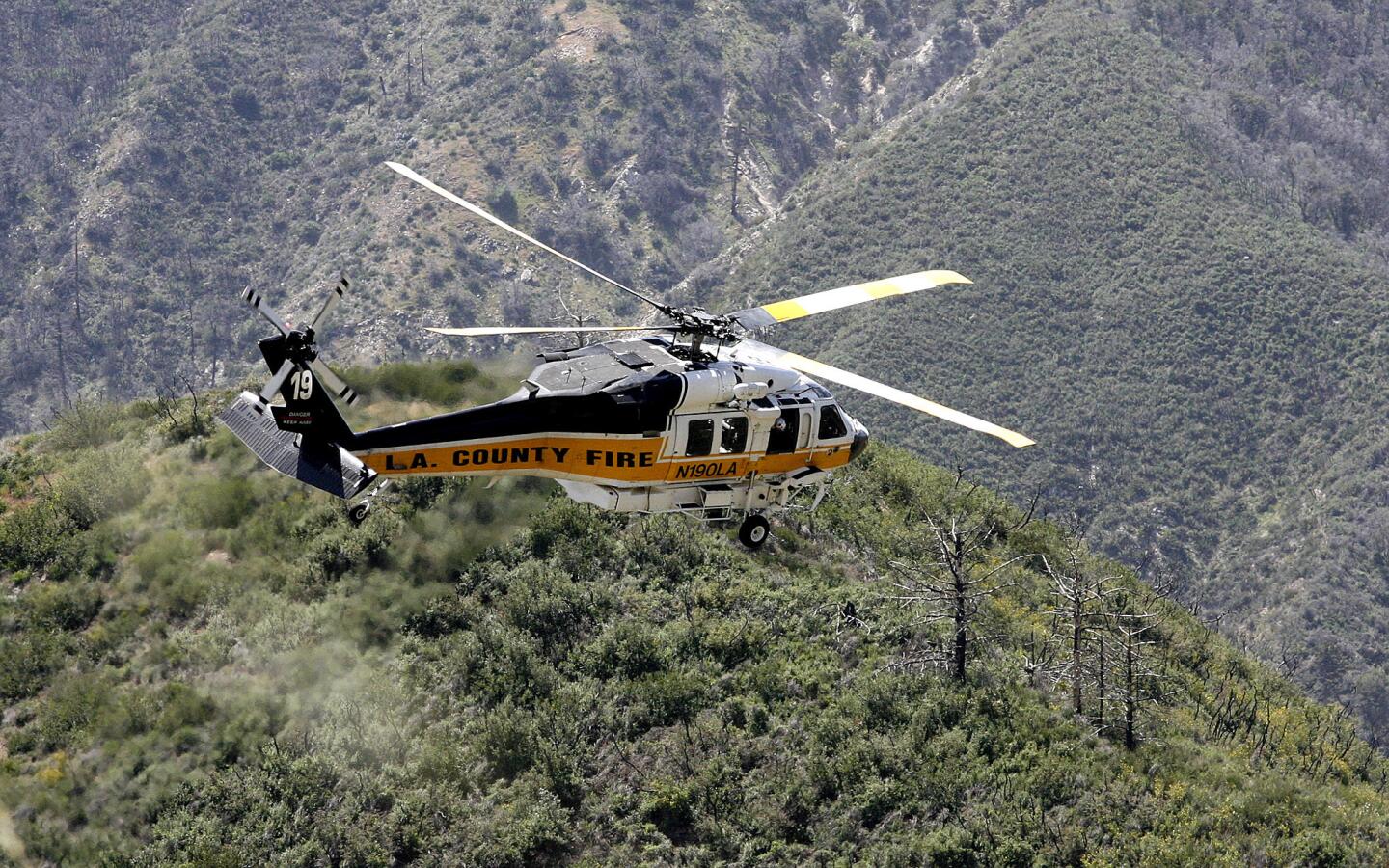 Photo Gallery: Vehicle found over the edge in Angeles National Forest