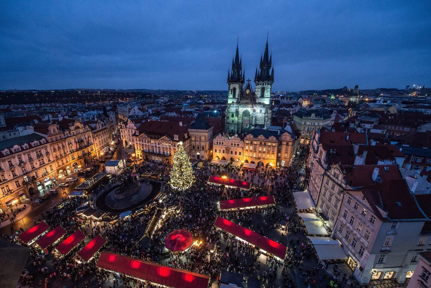 The Old Town Square in Prague has a Christmas market. Tourists and locals gather around the Christmas tree — one of the largest in the country — and listen to carolers perform. Vendors also sell gastronomic specialties, such as barbecued pork, blood sausage, Czech muffins and trdelník — a hot, sugar-coated pastry.