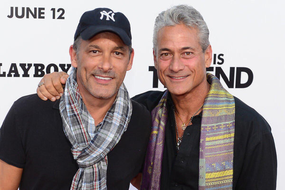 Johnny Chaillot, left, and ormer Olympic Gold medallist diver Greg Louganis, shown at the June 3 premiere of "This Is The End" in Los Angeles, are engaged.