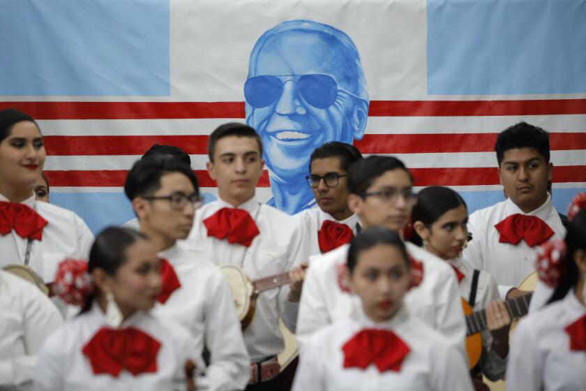 FILE - In this Jan. 11, 2020, file photo, a Mariachi band waits to perform before a campaign event with former Vice President and Democratic presidential candidate Joe Biden in Las Vegas. In Joe Biden’s pursuit of the Democratic presidential nomination, he’s run repeatedly into a wall in the West, where Bernie Sanders’ strength among Latinos propelled his campaign even as he struggled with other groups. Tuesday’s primaries in Arizona and Florida offer Biden a chance to show he can make up ground with Latinos, a crucial group of voters he’ll need in his corner to defeat Trump (AP Photo/John Locher, File)