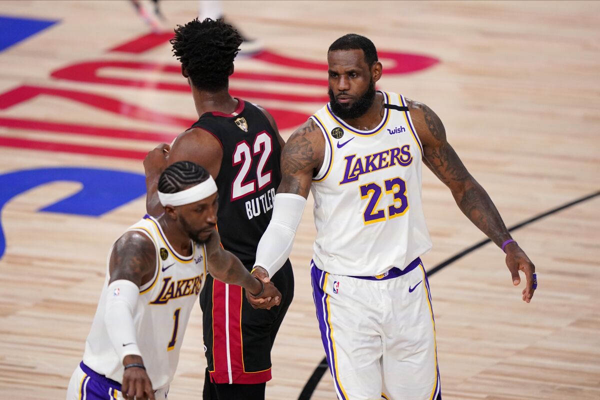 Forward LeBron James celebrates with guard Kentavious Caldwell-Pope as the Lakers open a double-digit lead in Game 6.