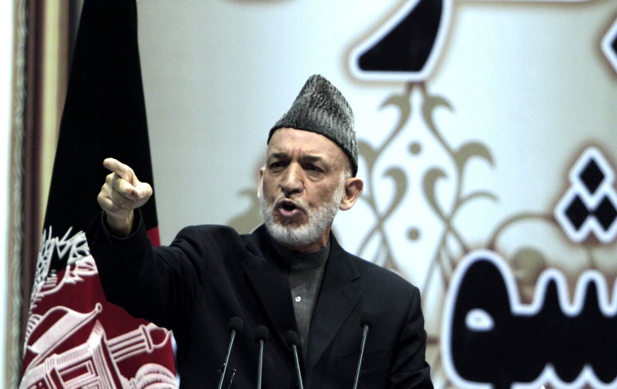 Afghan President Hamid Karzai speaks during a national consultative council, known as a loya jirga, in Kabul.