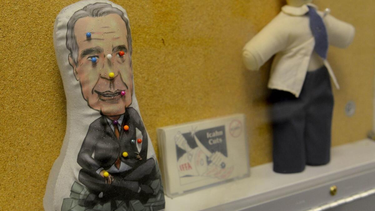 Voodoo dolls representing onetime TWA shareholder Carl Icahn are among artifacts on display at the TWA Museum.