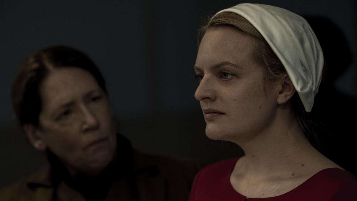 Ann Dowd as Aunt Lydia, left, and Elisabeth Moss as June/Offred in a scene from Season 2 of "The Handmaid's Tale."