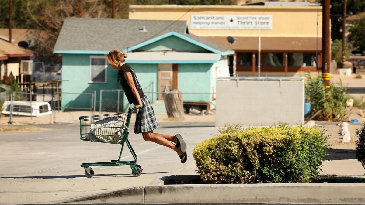 A pedestrian passes through Old Town Victorville. The Victorville housing market has recovered somewhat from the recession, but far less than other areas in Southern California.