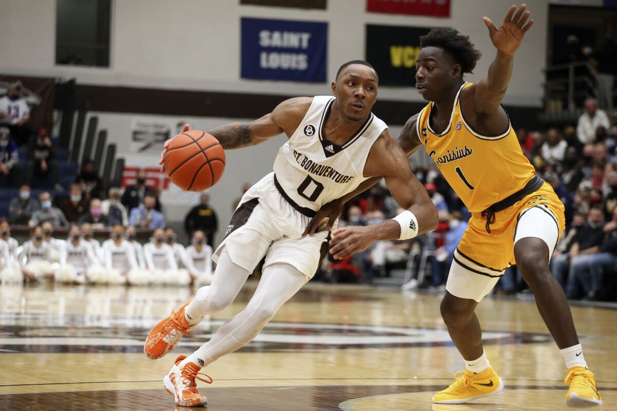 St. Bonaventure guard Kyle Lofton (0) drives to the hoop while defended by Canisius guard Ahamadou Fofana (1) during the first half of an NCAA college basketball game, Sunday, Nov. 14, 2021, in Olean N.Y. (AP Photo/Joshua Bessex)