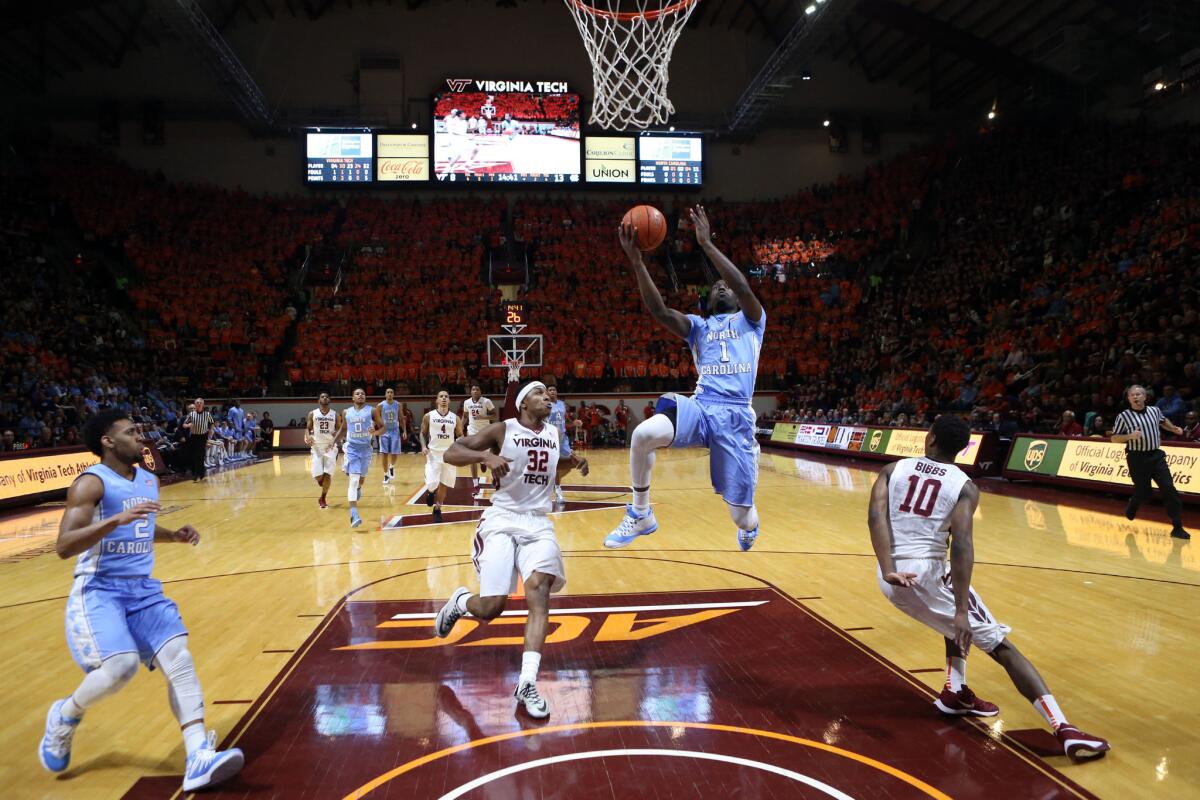 North Carolina forward Theo Pinson (1) drives towards the basket during the first half against Virginia Tech.