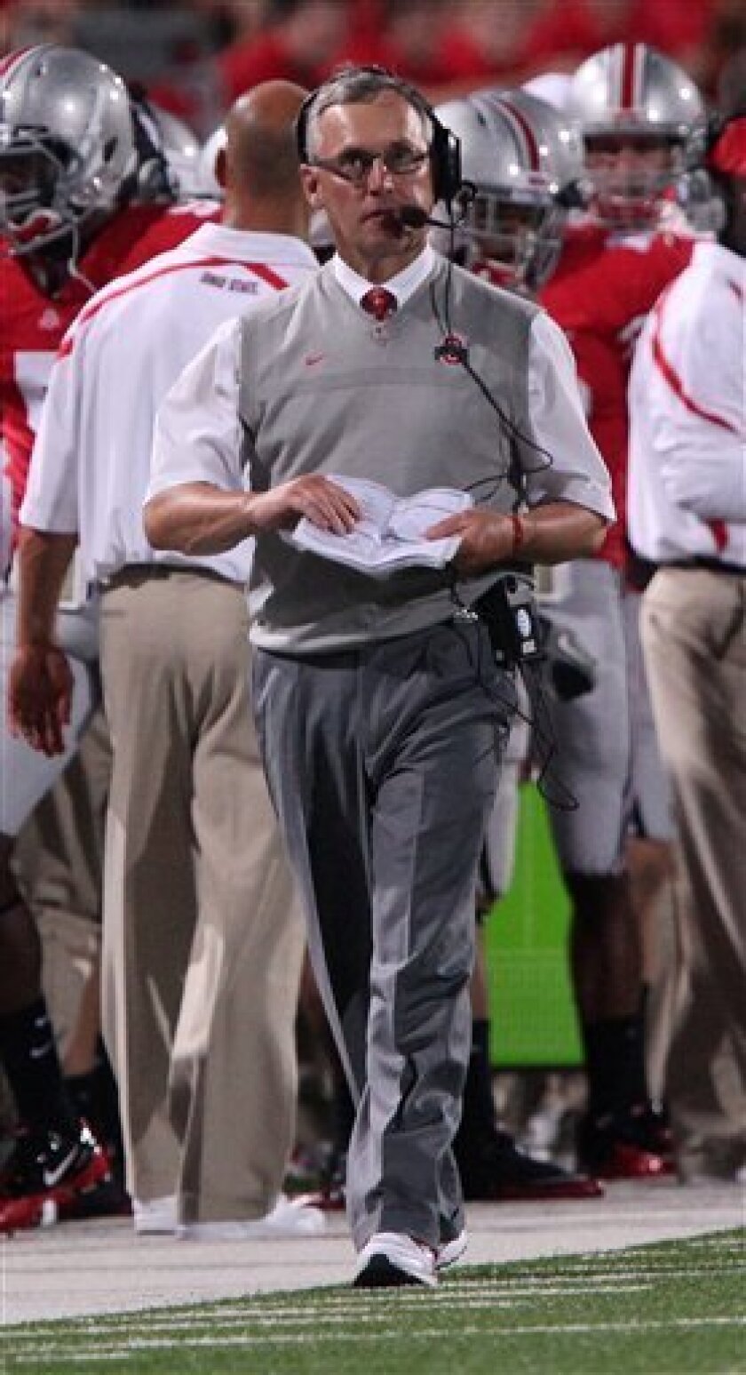 Ohio State coach Jim Tressel works the sidelines against Marshall during the second half of an NCAA college football game Thursday, Sept. 2, 2010, in Columbus, Ohio. Ohio State beat Marshall 45-7. (AP Photo/Terry Gilliam)