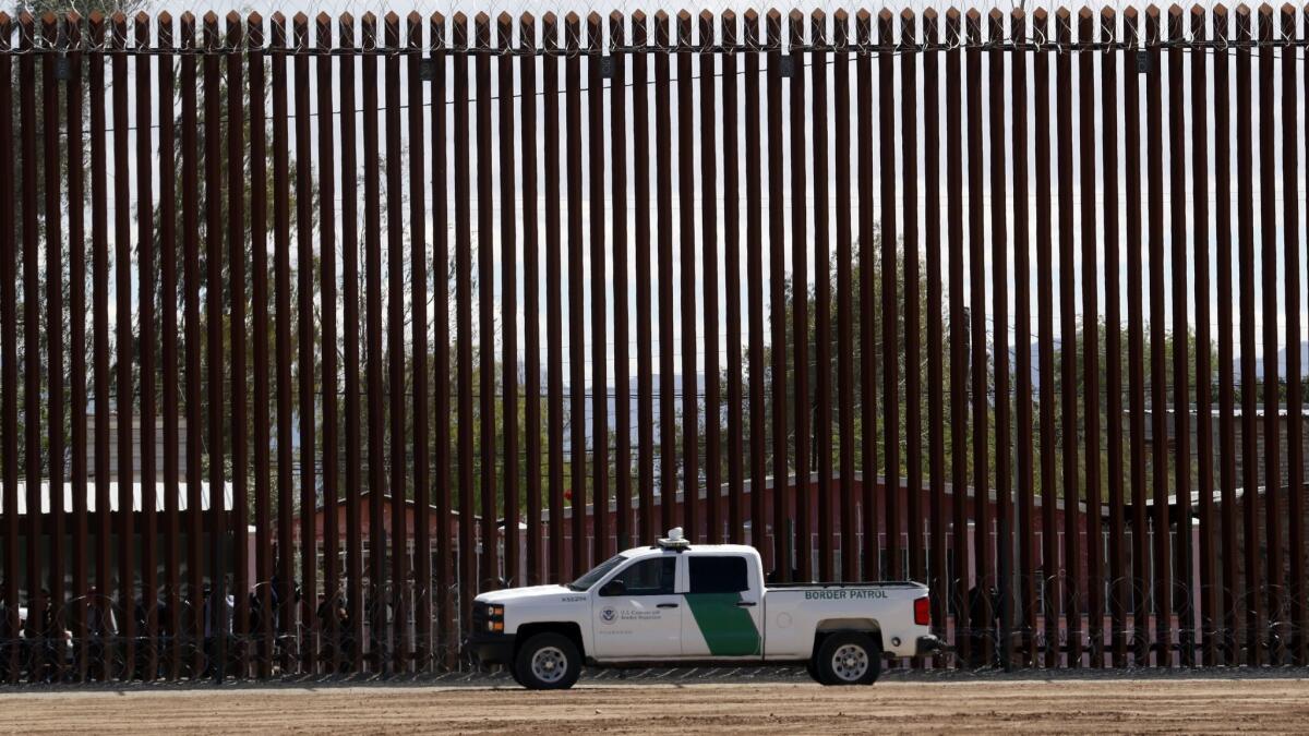 A U.S. Customs and Border Protection vehicle near the border wall in April.