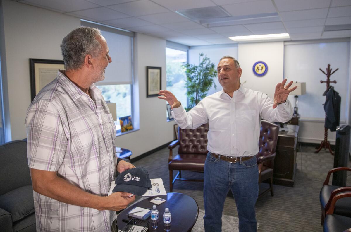 George Sams of Placentia talks with Rep. Gil Cisneros.