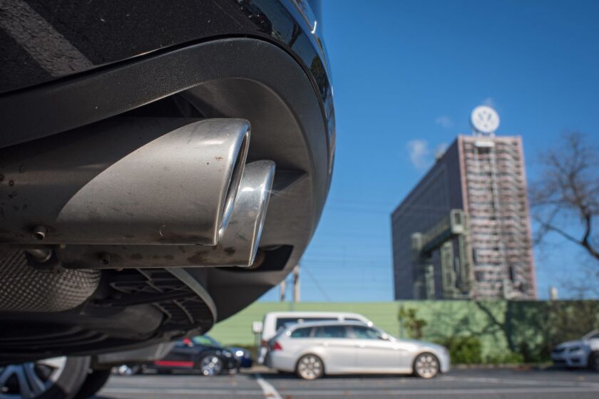 The exhaust pipe of a Volkswagen Passat pictured in front of the Volkswagen plant in Wolfsburg, Germany.
