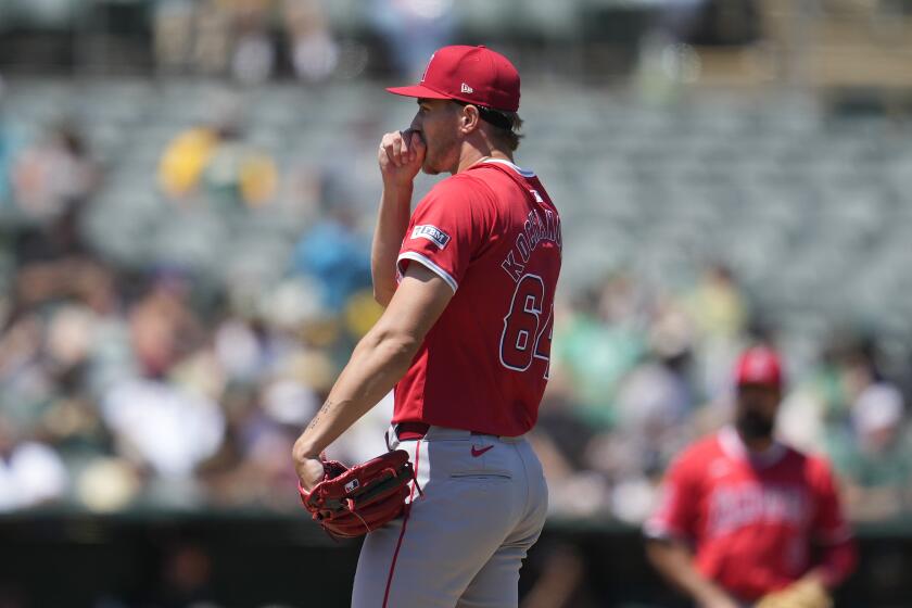 Los Angeles Angels pitcher Jack Kochanowicz reacts after walking Oakland Athletics' Max Schuemann with the bases loaded during the fourth inning of a baseball game in Oakland, Calif., Saturday, July 20, 2024. (AP Photo/Jeff Chiu)