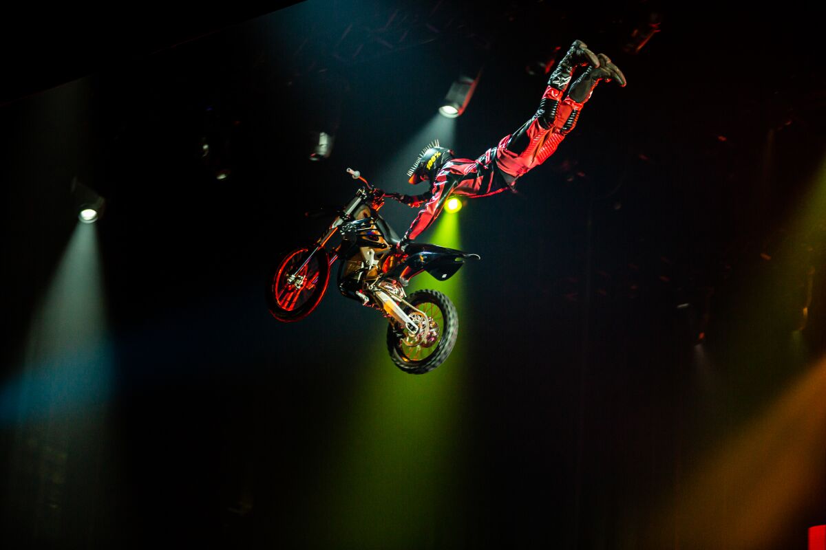 A stunt motorcyclist performs a jump during "R.U.N."