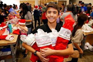 3028613_sd_me_difference_1205_NL San Diego, CA December 03, 2017 Making a Difference profile on 13-year-old Kenan Pala of Rancho Bernardo, who is the founder of the nonprofit foundation Kids4Community. Kenan will be leading a volunteer program Sunday to stuff more than 1,000 Christmas stockings for needy families served by Interfaith Community Services. Need a portrait shot of him for the year-end book, as well as some action shots of him leading the stocking-stuffing campaign for the article. © 2017 Nancee E. Lewis / Nancee Lewis Photography. No other reproduction allow with out consent of licensor. Permission for advertising reproduction required.