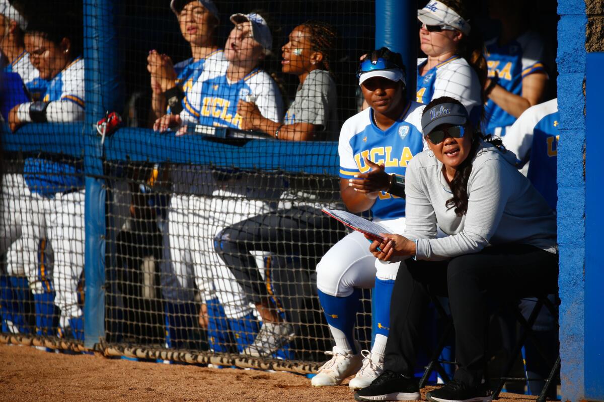 UCLA softball coach Kelly Inouye-­Perez, right, is shown during an NCAA Super Regional game on May 25, 2019.