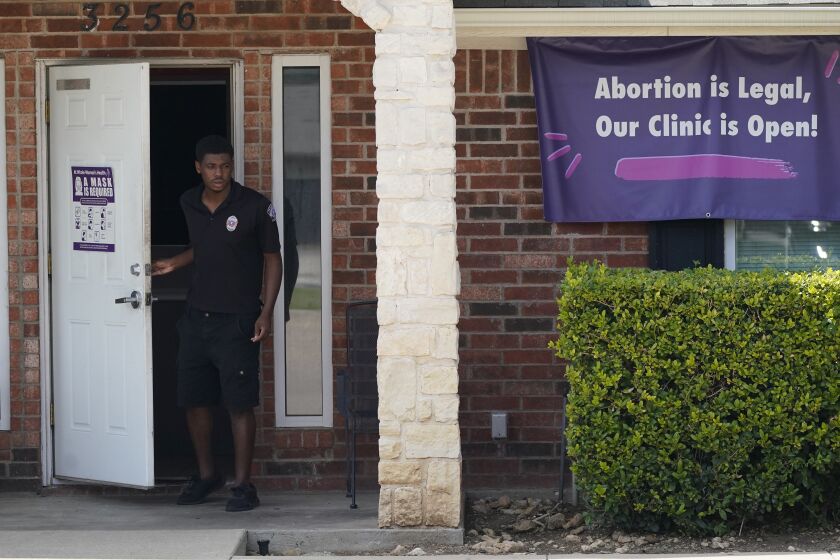 A security guard outside the Whole Women's Health Clinic in Fort Worth, Texas, on Wednesday.