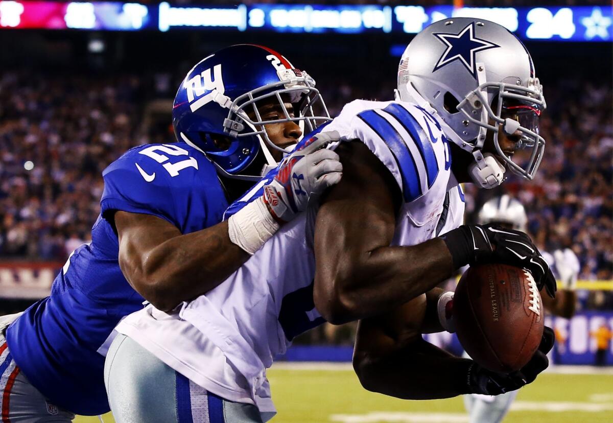 Cowboys wide receiver Dez Bryant brings down the game-winning touchdown catch against Giants cornerback Dominique Rodgers-Cromartie late in the fourth quarter Sunday.