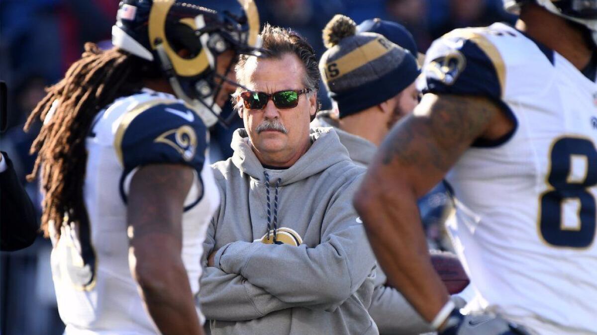 Rams Coach Jeff Fisher watches his players warm up before a game with the New England Patriots at Gillette Stadium in Foxborough, Mass. on Dec. 4.