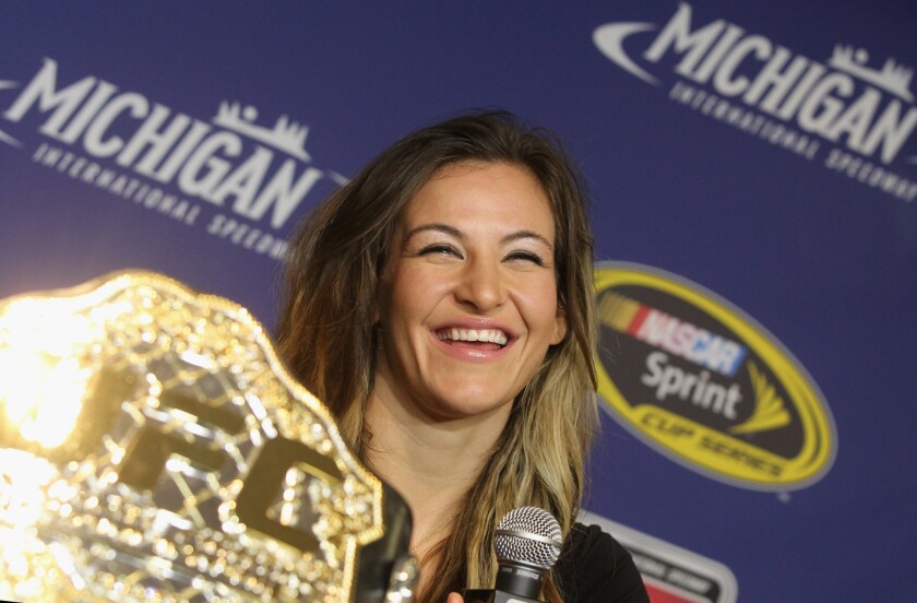 UFC women's bantamweight champion Miesha Tate addresses the media as the Grand Marshall for the NASCAR Sprint Cup Series FireKeepers Casino 400 on June 12.