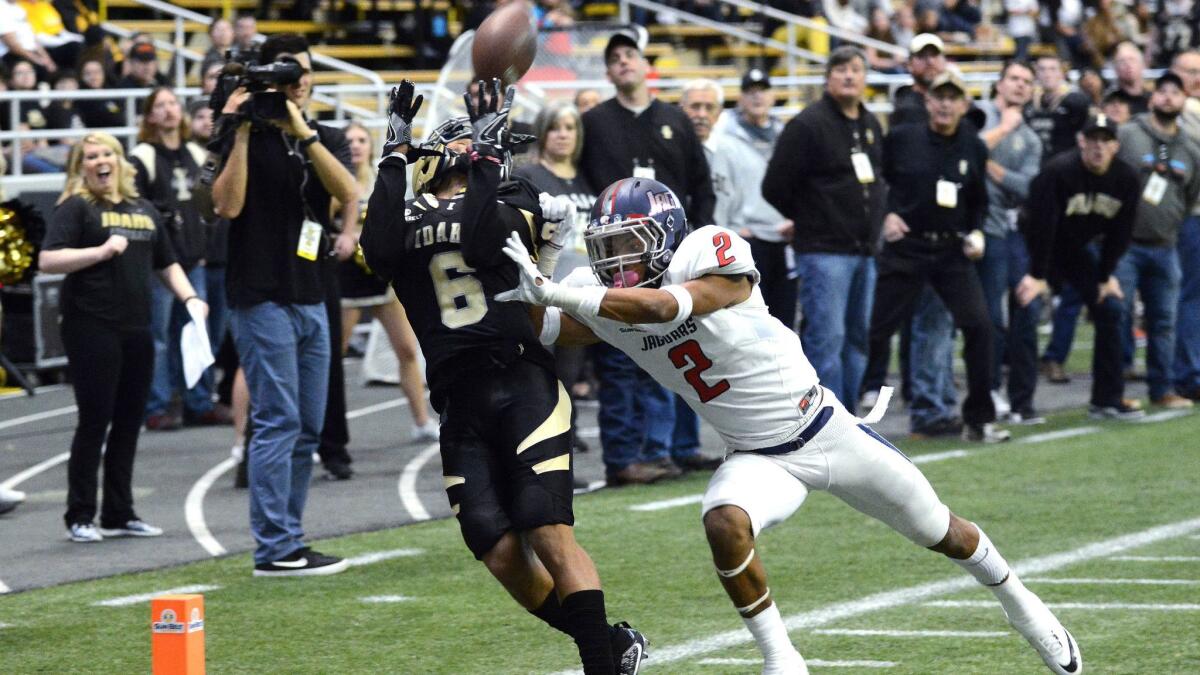 Idaho's Callen Hightower makes a touchdown reception in front of South Alabama's Jalen Thompson on Nov. 26.