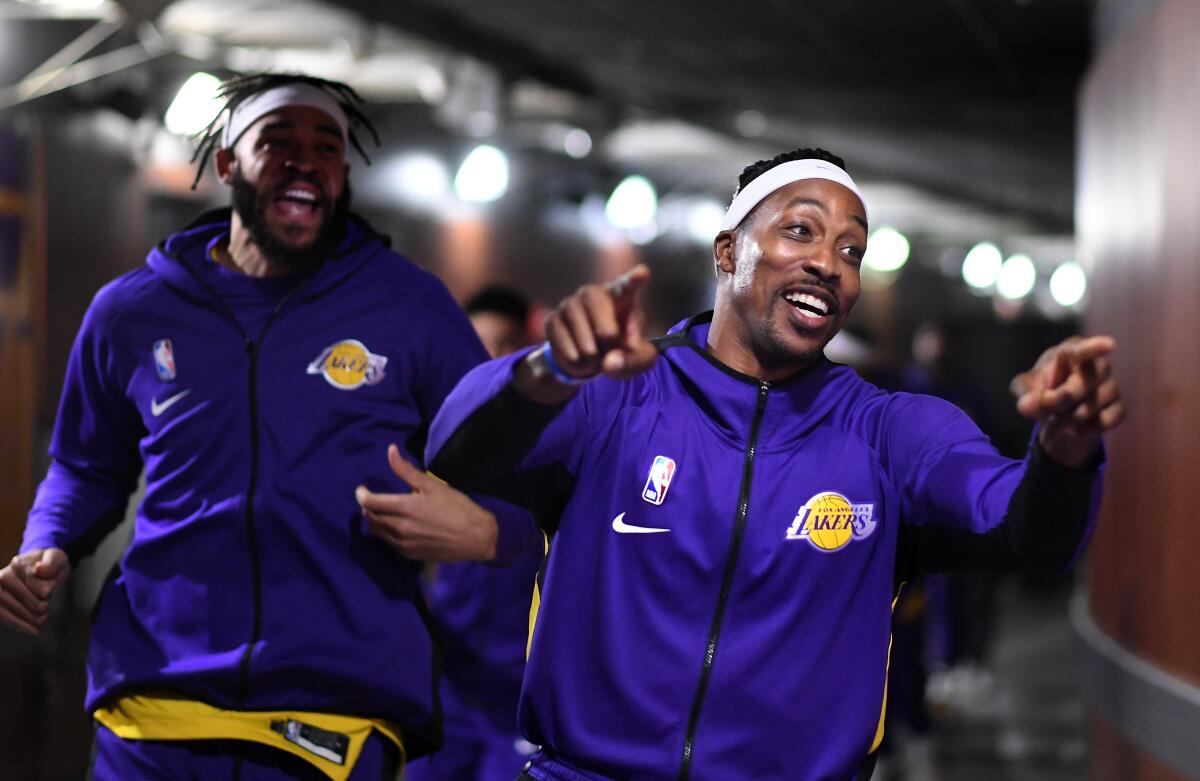 Dwight Howard leads Lakers to the court before Jan. 7 Knicks game at Staples Center.