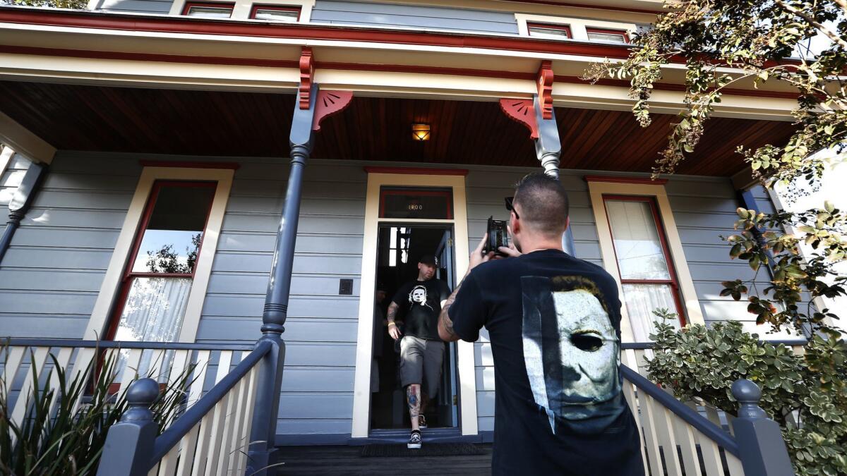 Daniel Patton, left, of San Francisco, and friend Mat Dedoussis of New Jersey visit the "Myers house" in South Pasadena.
