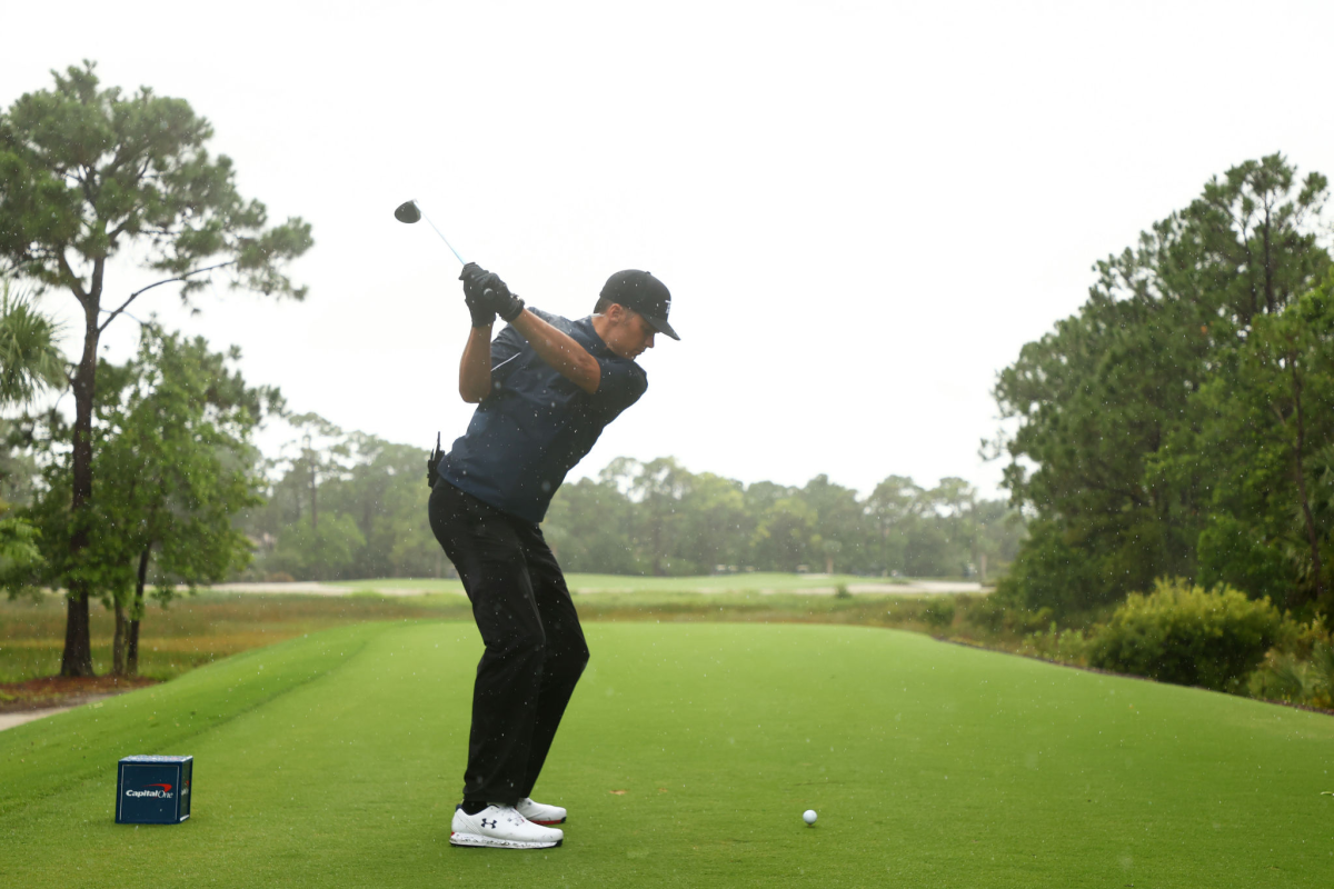 HOBE SOUND, FLORIDA - MAY 24: NFL player Tom Brady of the Tampa Bay Buccaneers plays his shot.