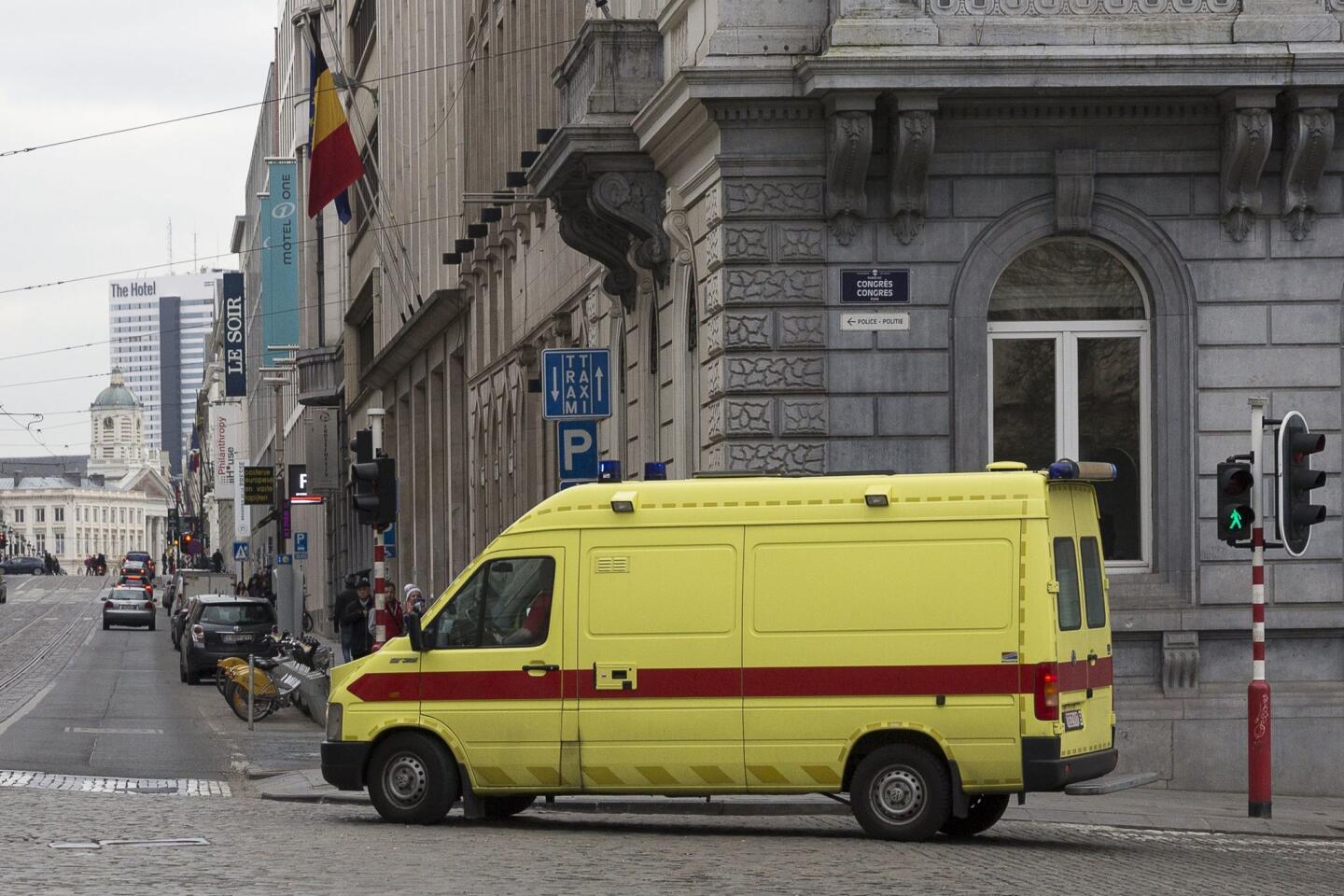 An ambulance believed to be transporting top Paris attacks suspect Salah Abdeslam leaves the building of the Federal Police in Brussels on March 19, 2016.