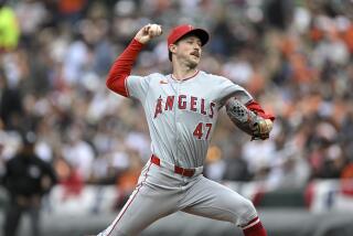 Los Angeles Angels starting pitcher Griffin Canning (47) throws during the first inning.