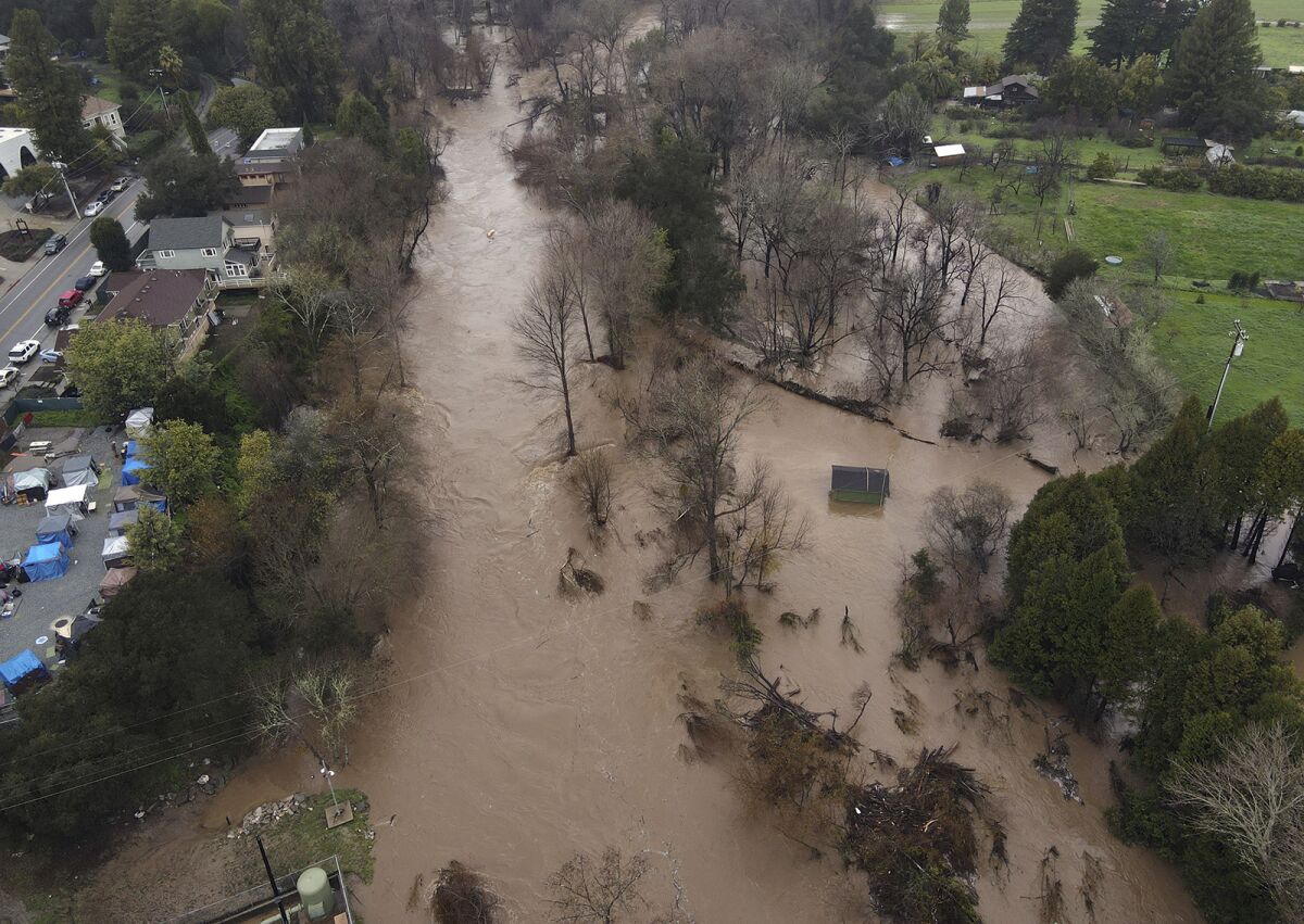 An aerial view of an overflowing river.