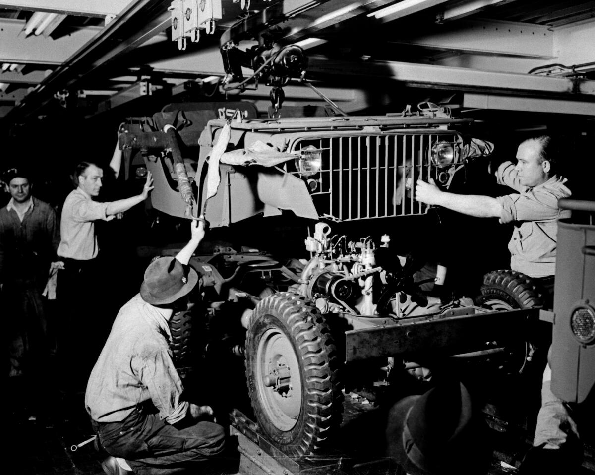 Jeeps are assembled at the Ford River Rouge plant in Detroit during World War II.
