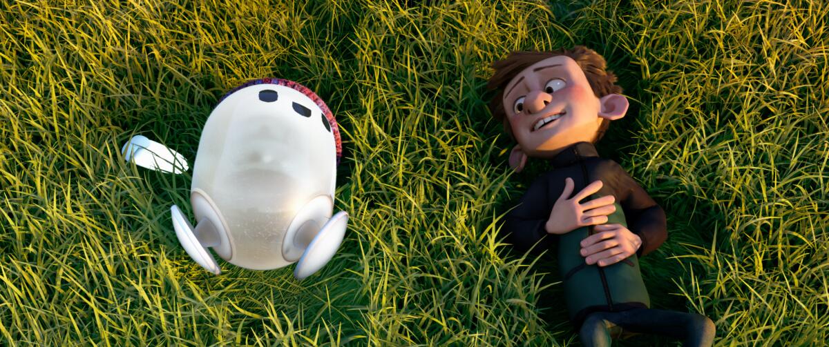  A boy and his ambulatory digital device lie on grass in the animated movie "Ron's Gone Wrong."